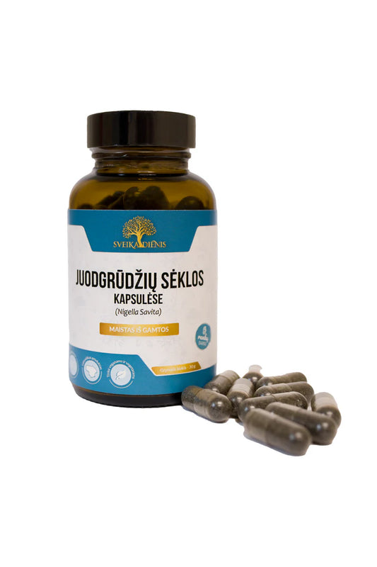 Loose black cumin seed capsules next to Sveikadienis amber bottle packaging